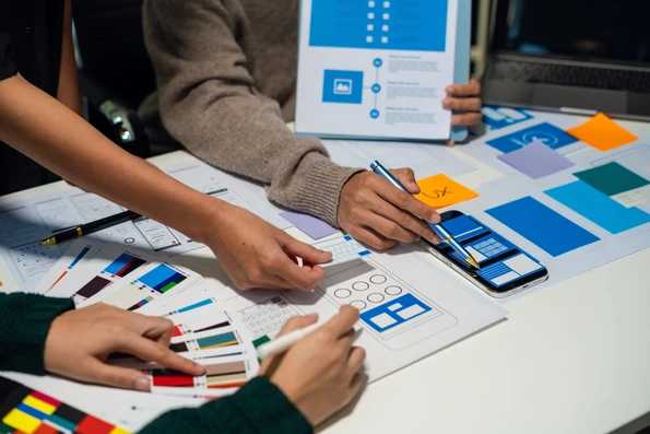 WordPress website design services - 3 designers working.